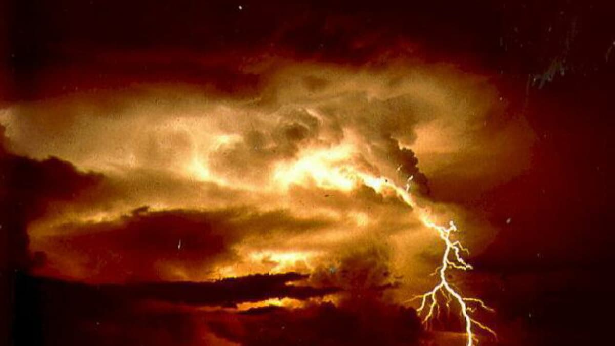 Bright lightning illuminating a dark stormy sky.